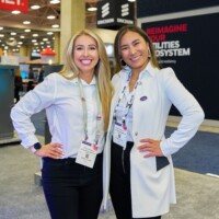 Two JST Power Equipment team members at DISTRIBUTECH 2025