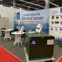 JST presents its transformer and switchgear technologies at RE+ Mexico, highlighting sustainable and innovative power solutions. JST booth at RE+ Mexico 2025 featuring a green transformer switchgear equipment, and a branded backdrop promoting electrical power solutions.